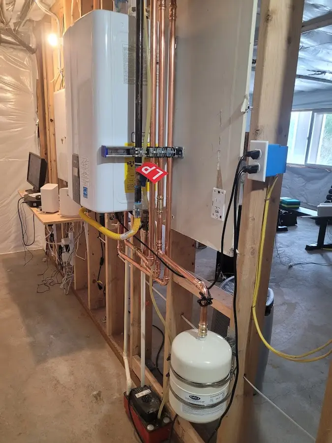 Licensed plumber repairing a kitchen sink in Preston